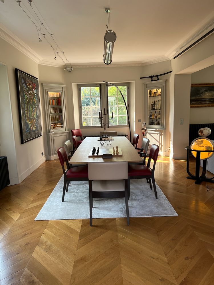 The dining room framed by built-in bookcases