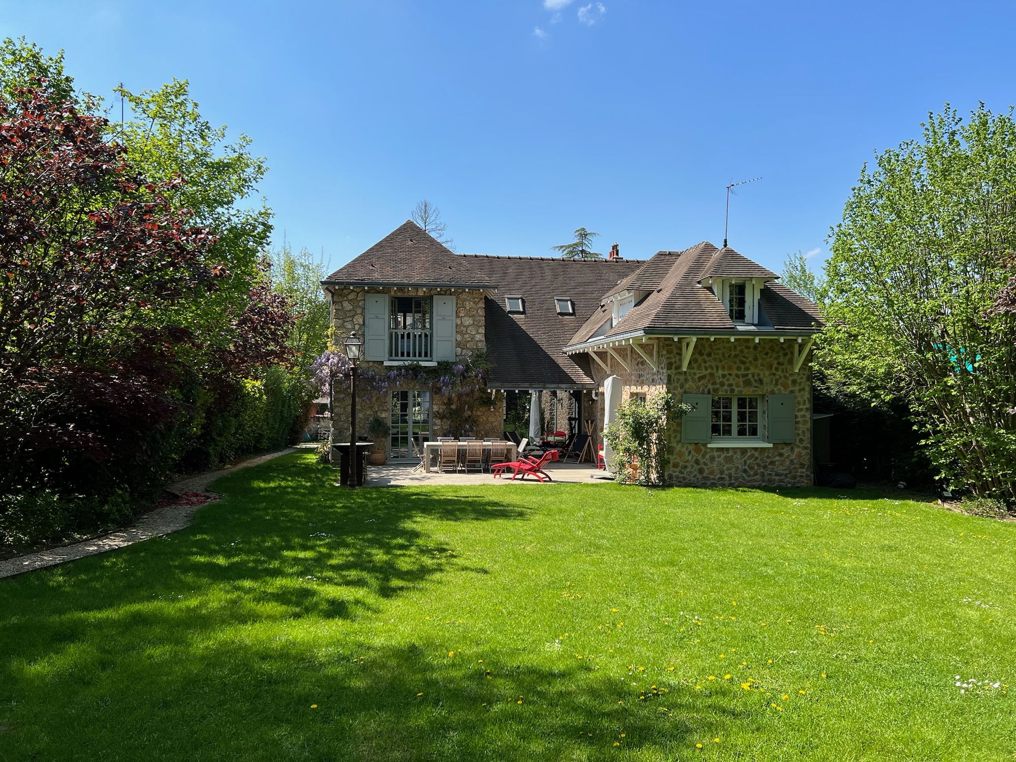 The garden façade in spring, seen across the lawn