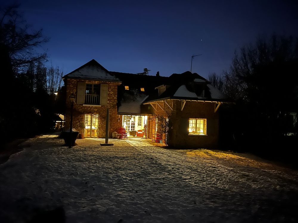 The house at blue hour after snowfall